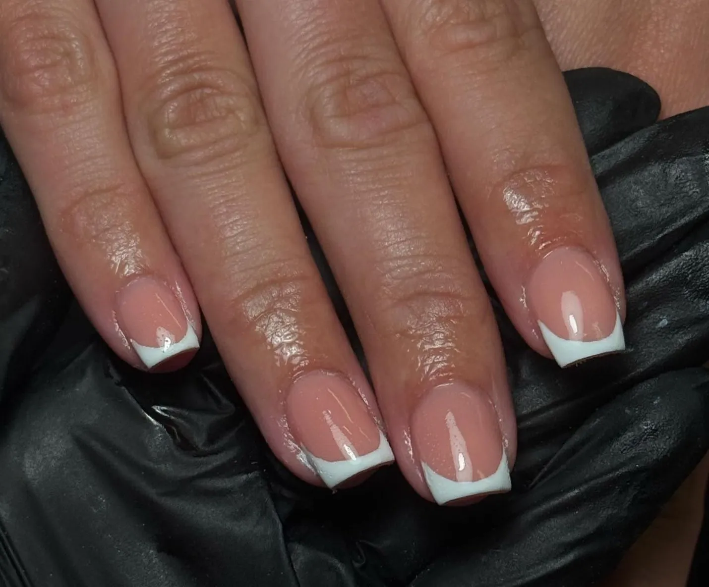 Client with french tip nail art by Jodie Leslie.