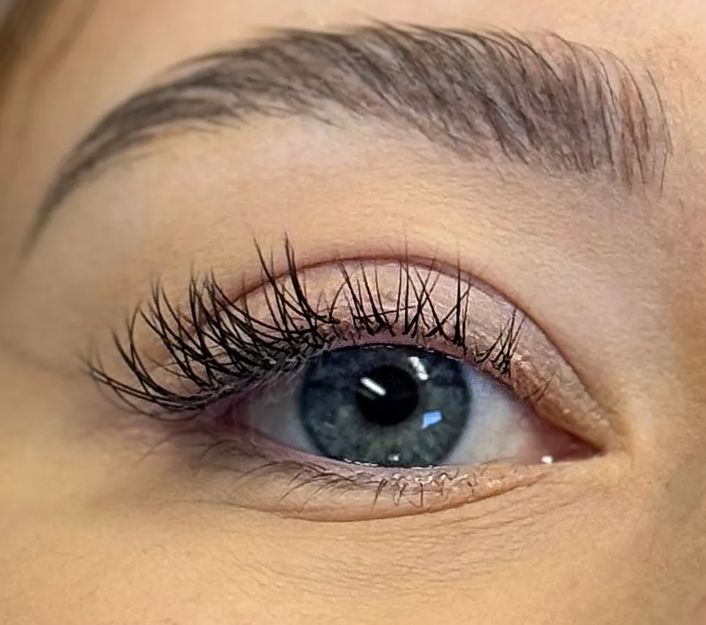 Client with half lash list and half lash extensions by Jodie Leslie.